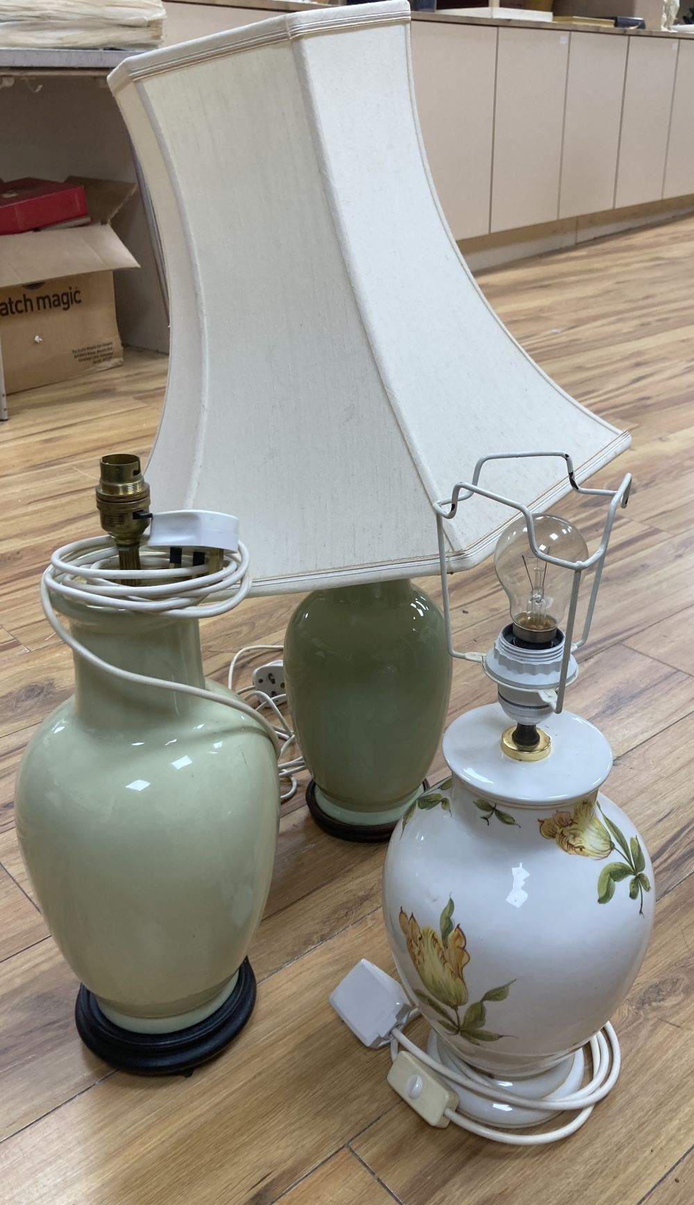 A pair lime-green glazed table lamps, 38cm, one with shade and one other earthenware lamp